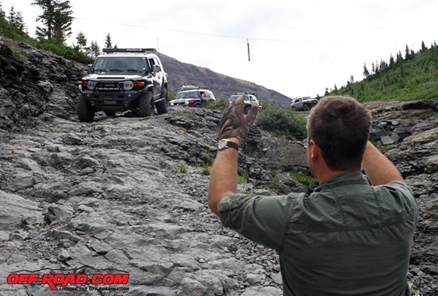 The folks from FJ Summit parked trail guides on the hairier runs, and there were no less than four working Ingram/Black Bear. Every once and a while, its good to have a little guidance: this trail is tricky. A section of a suspended footbridge hangs in the background.