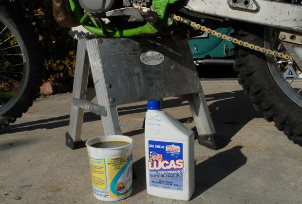 Its always a good idea to swap out the crankcase oil every few rides. We replaced ours with Lucas Oils 10W40 Motorcycle oil, marking on the bottle the amount our Kawasaki service manual noted for each change. 