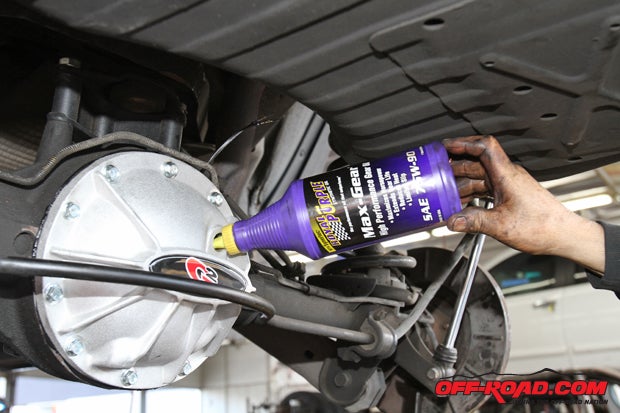 With the E-Locker and new G2 gears all buttoned up, its time to add gear oil. We opted for Royal Purples Max Gear synthetic oil. Royal Purples products arent cheap, but this synthetic oil, which features Royal Purples proprietary Synerlec additive, is designed to run quieter, cooler and reduce wear compared to standard oil.