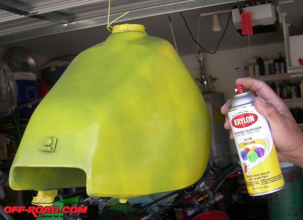 The awful blue color of the gas tank was covered with several good coats of Krylon Sun Yellow, a perfect match for Suzuki colors.