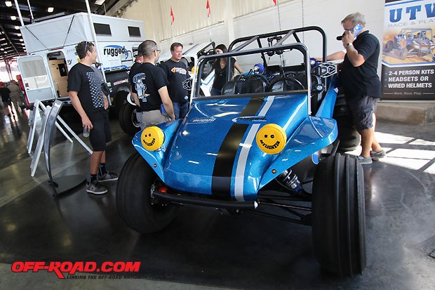 Rugged Radios made a splash at the Sand Sports Super Show with their latest race radios and on-board communication systems.  This year they also brought along a custom made beach buggy with fiberglass bodyreminiscent of the Meyers Manx.  The best part, its sitting on top of a Polaris 1000 RZR.