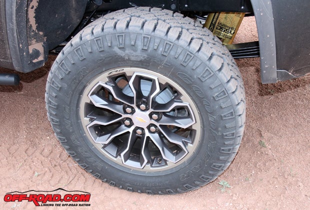 The ZR2 features 31-inch Goodyear Duratrac all-terrain tires. Just behind the tires the unique Multimatic DSSV dampers are visible. 