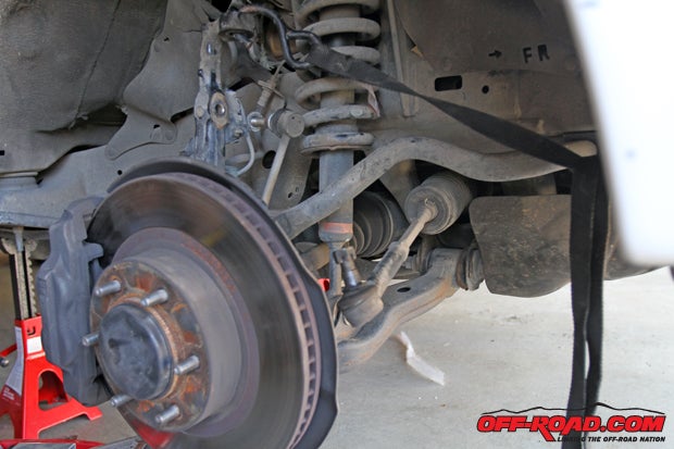 Once the spindle is separated its important to support the lower portion of the IFS suspension (the spindle, lower control arm, brake lines, etc.) so that none of the parts get damaged. The brake lines specifically are the most vulnerable to being damaged if not supported properly.