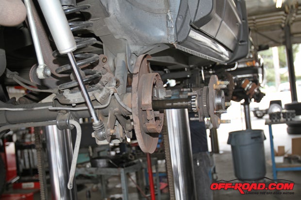 The axle shaft is pulled from the housing during the installation.